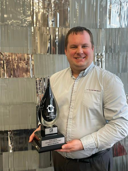 Kyle Olson receiving the 2022 North Dakota Association of Realtors Good Neighbor award!